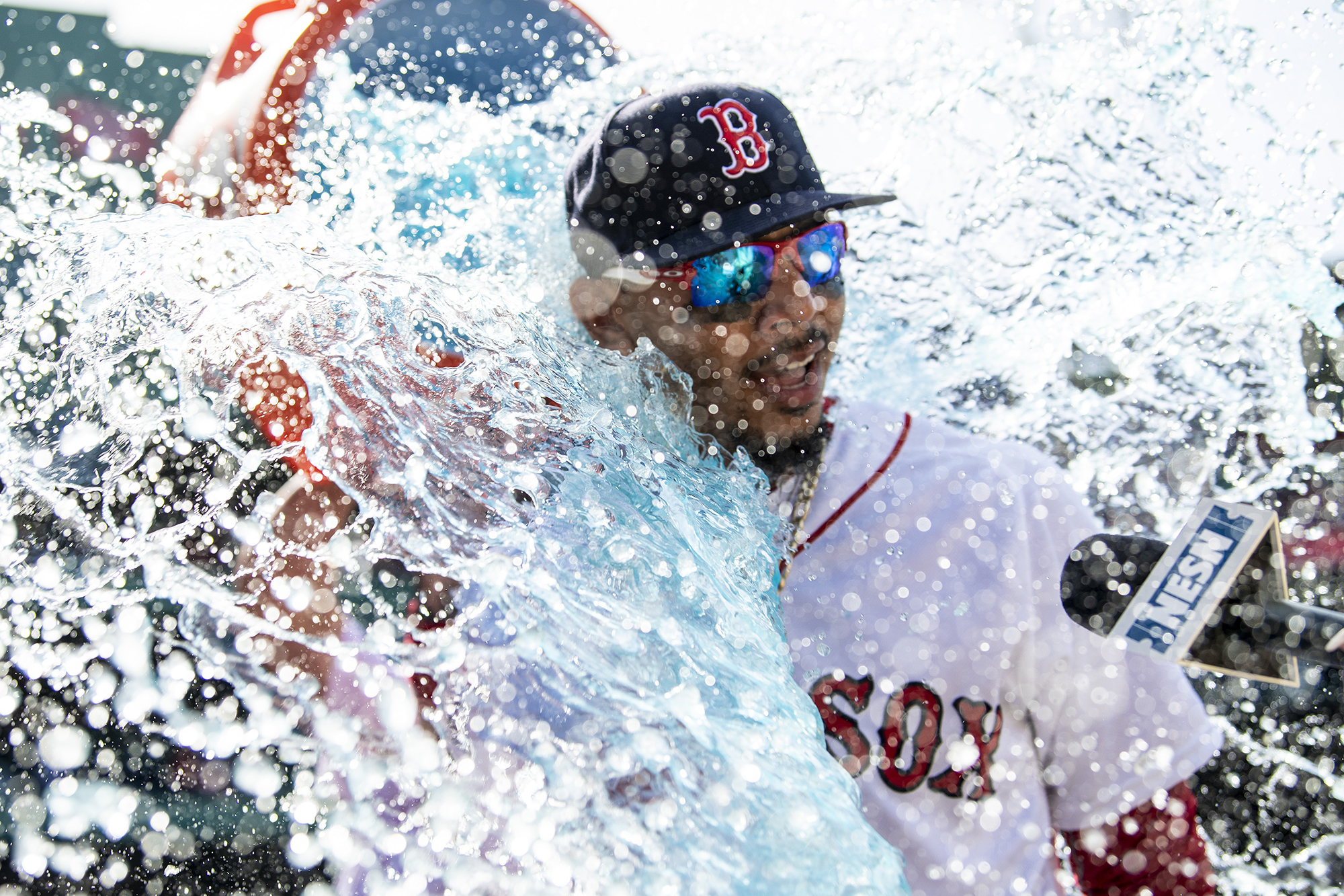 Mookie Betts is dowsed with Gatorade after hitting three home runs against Kansas City in 2018.