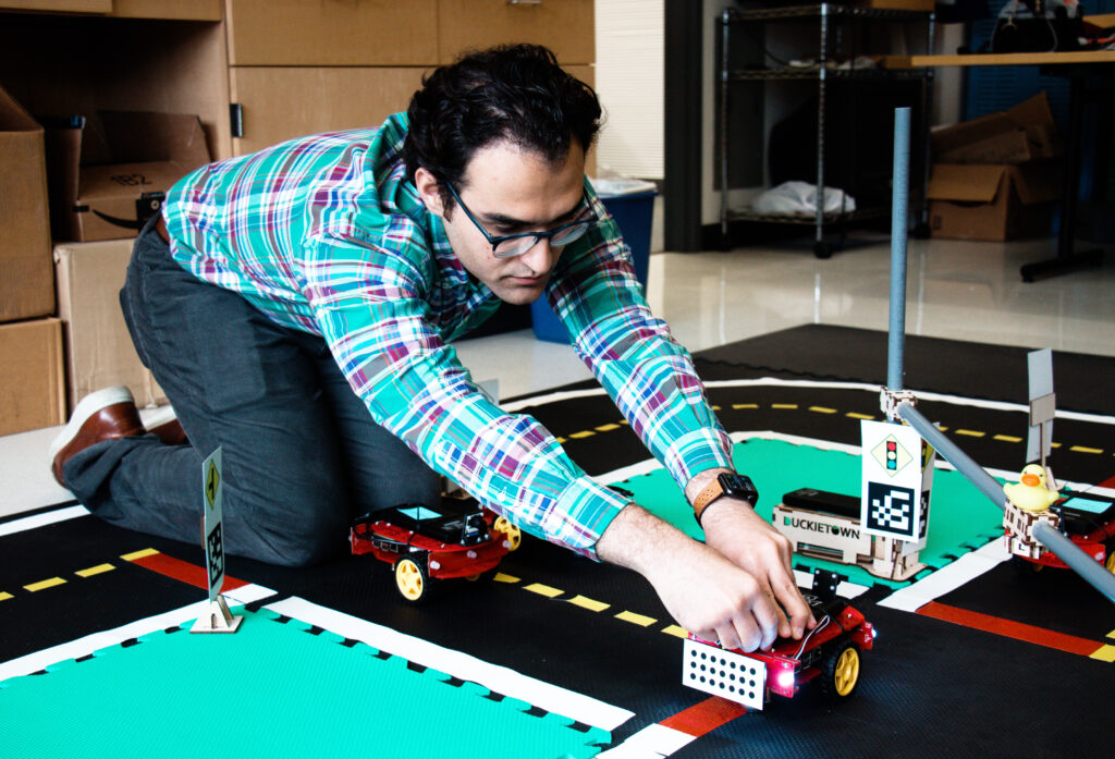 Arian Houshmand(ENG'20) is an internantional student in Systems Engineering from Iran. Houdhman and his teammatesbuilt a traffic simulation in the lab to run demos. Houshmand and his teammates each built a demo car and named the cars after their names.