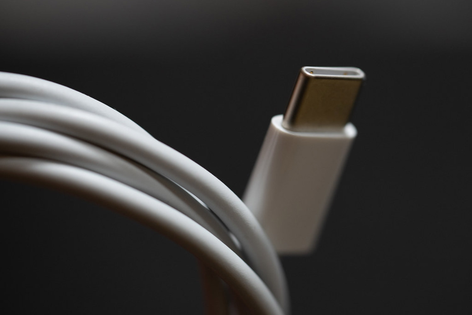 Close up detail photo of a USB charging cable for a smartphone or ipod