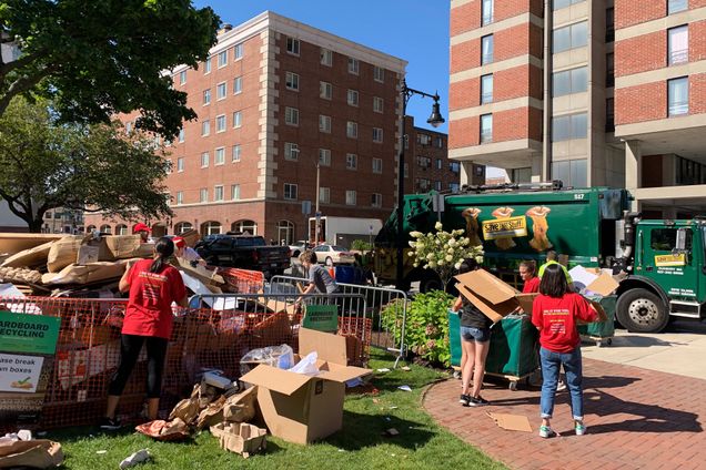 members of BU’s Scarlet Squad prepare cardboard for recycling