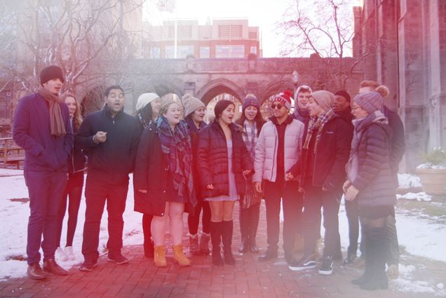 BU BosTones a cappella group performing in front of Marsh Chapel.