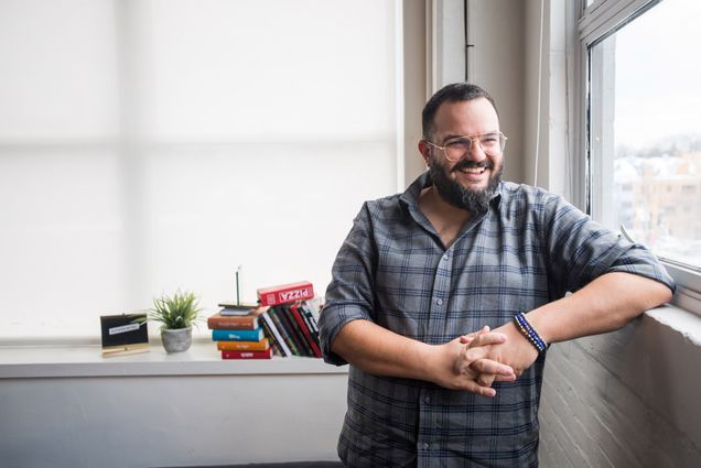 Assaf Swissa, Founder and Creative Director of Superdigital poses for a photo in his Comm Ave office