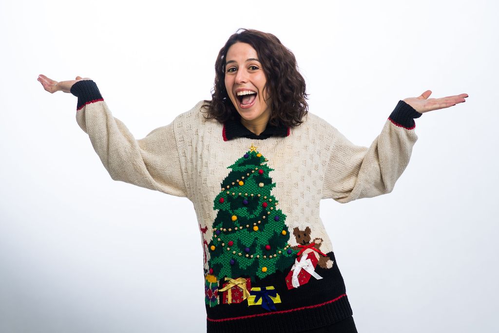 Allyson McHugh (SSW’22) sports a holiday sweater from the 80's complete with a color and shoulder pads.