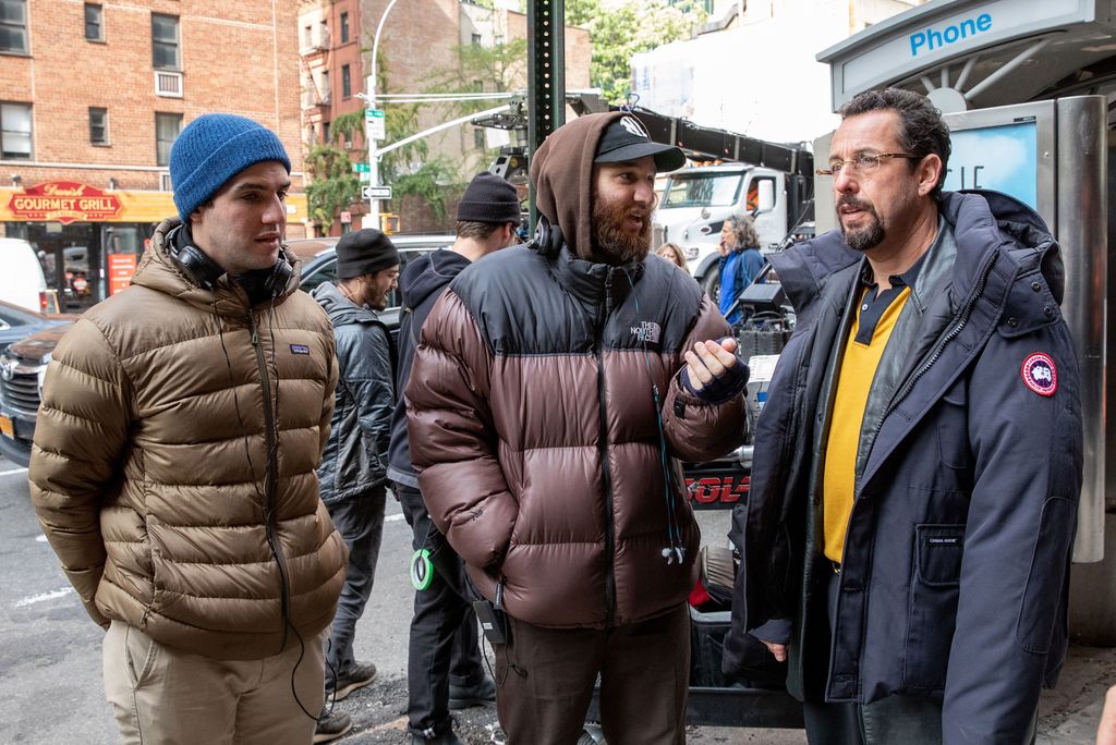 Benny and Josh Safdie (from left) take to the streets of Manhattan’s Diamond District as they direct Adam Sandler in Uncut Gems