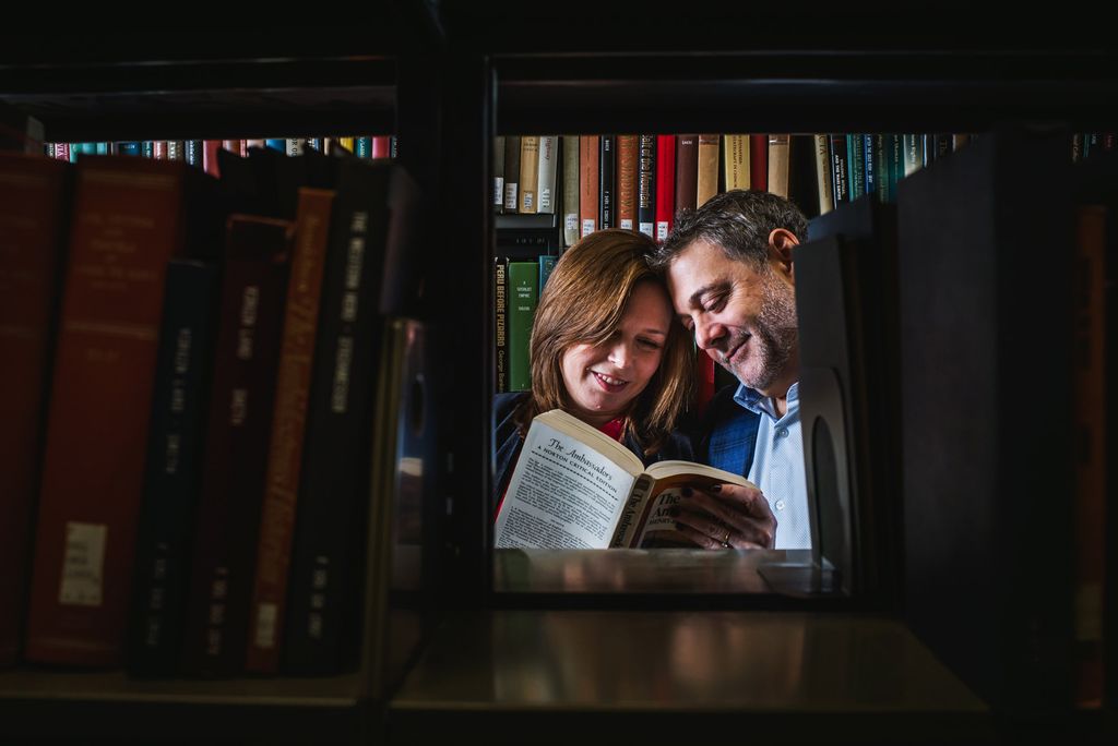 A photo of Anne (Salzberg) Olshan (CAS’89, COM’89) and John Olshan (CGS’87, CAS’89) in the stacks at Mugar Library