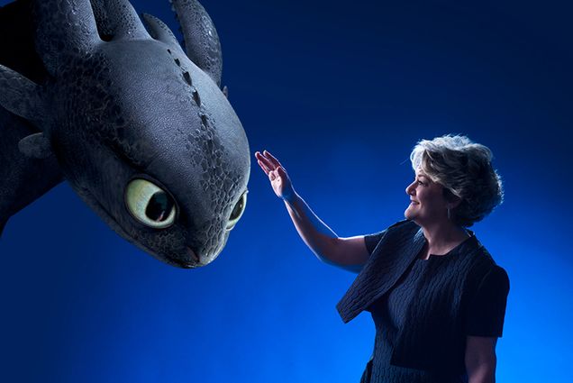 How to Train Your Dragon producer Bonnie Arnold pets an animated dragon