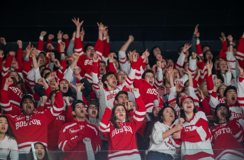 The BU Dogpound reacts to Boston University's 4th goal sending the game into overtime. 