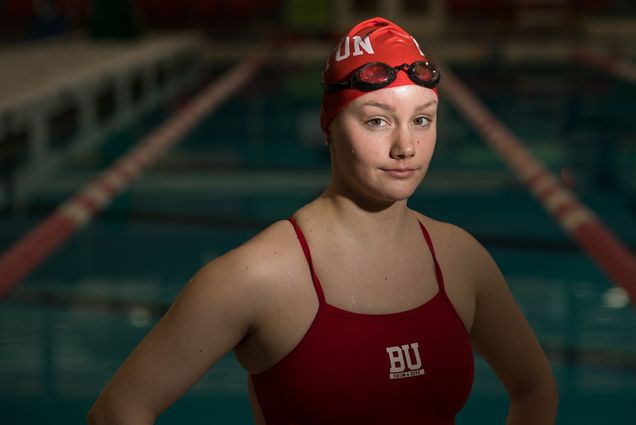 Portrait of swimmer Carly Soares (CFA’20) in front of pool.