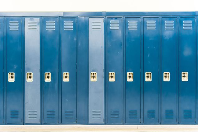 Image of dark and light blue lockers in a row.