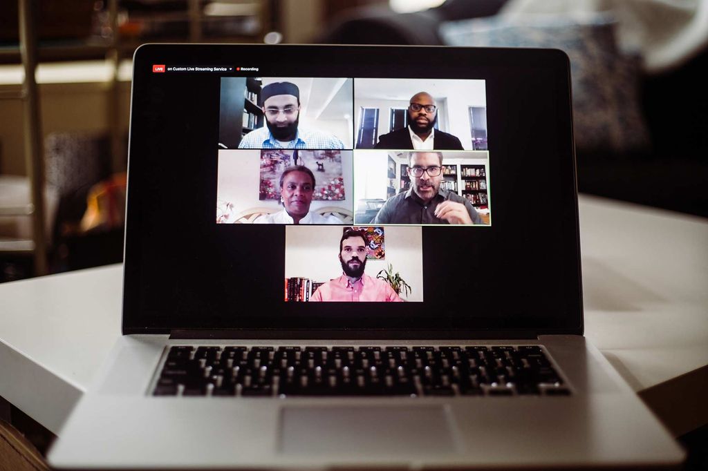 Laptop displaying Zoom panel discussion on the topic of A Clergy Conversation on Strategies for Change in Race Relations during Boston University's Day of Collective Engagment