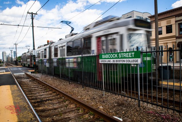 A photo of a green line train at Babcock Street on Commonwealth Ave.