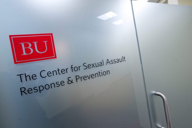 Photo of exterior view of the Sexual Assault & Rape Prevention Center - SARP. The frosted glass door has the SARP name and BU logo.