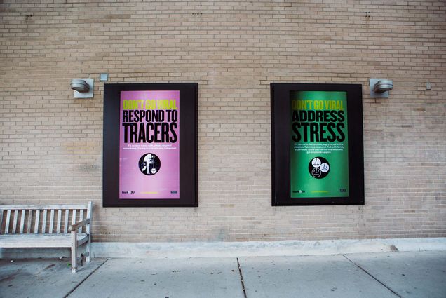 Photo of two signs outside of warren towers. The one on the right is purple and says “Don’t go Viral, respond to tracers.” The right one is green and says “Don’t go viral, address stress”