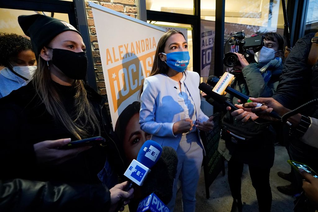 A photo of Alexandria Ocasio Cortez speaking to staffers and media after winning reelection to Congress on November 3, 2020