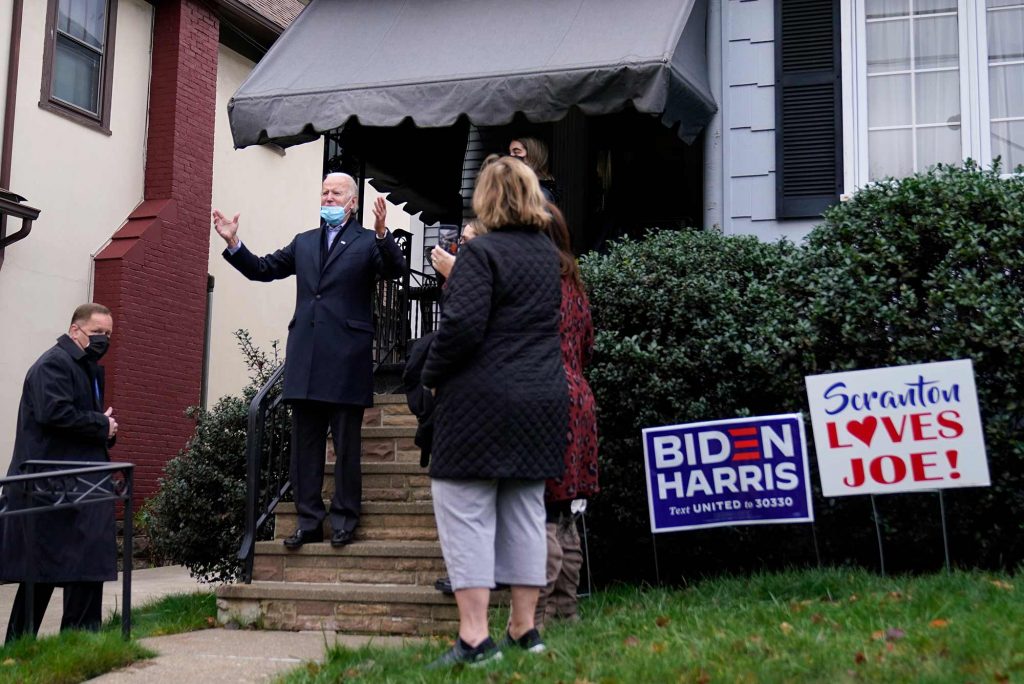 Joe Biden greets a crowd outside his childhood home in Scranton, Pennsylvania on election day, November 3, 2020