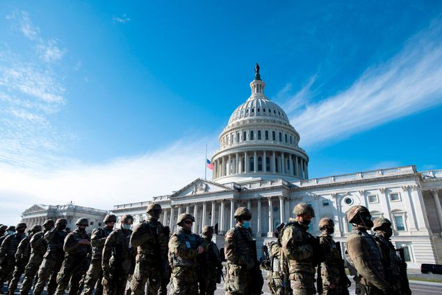 A photo of National Guard troops in front of the US Capitol