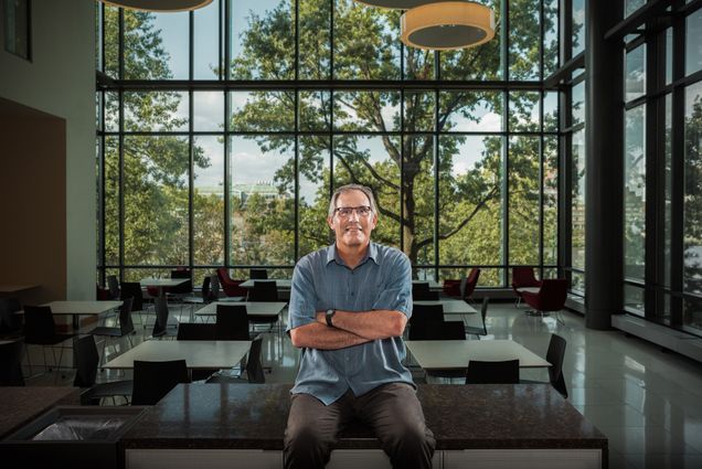 A photo of Jack Beerman sitting with his arms crossed