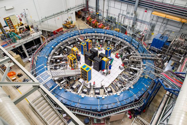 A photo of a donut-shaped ring that serves as a racetrack for particles called muons