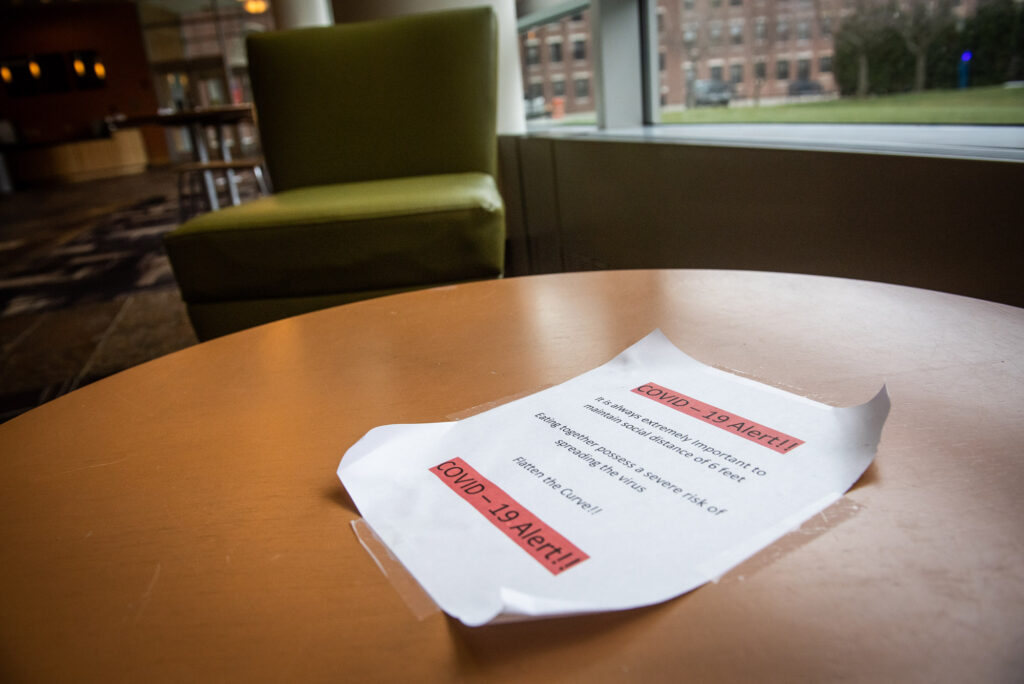 A flyer left on a table of the Fenway Campus on proper social distancing guidelines