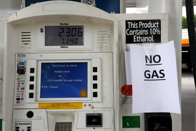 Photo of a shell gas pump with a sign that says “NO GAS” hanging on it.