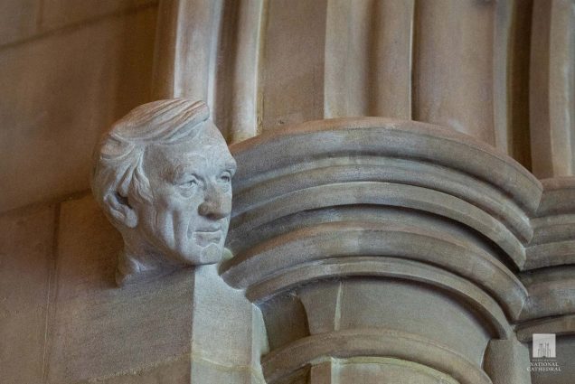 Photo of a marble, honorary bust of the late Holocaust chronicler Elie Wiesel (Hon.’74) at Washington National Cathedral’s Human Rights Porch. It protrudes from the top of a white marble column and looks to the left.