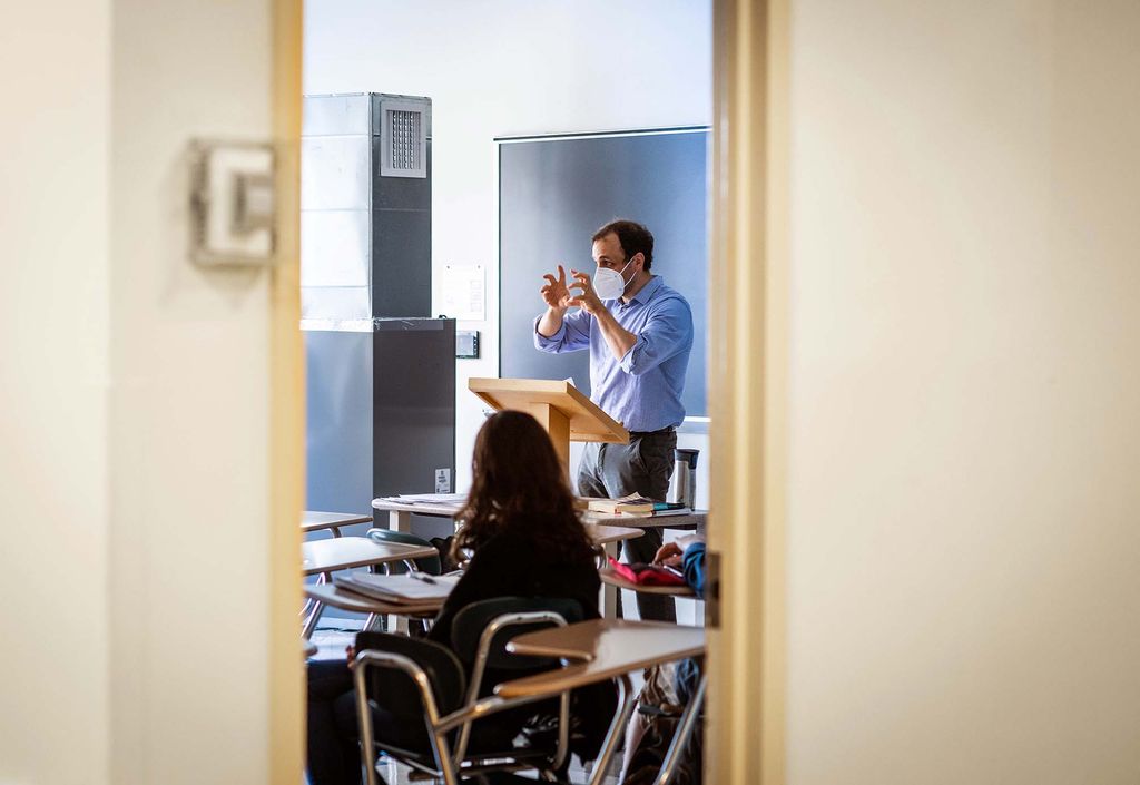 Professor Yuri Corrigan holds his hands expressively in the air while teaching Classics of Russian Prose at Boston University College of General Studies on the first day of classes, September 2, 2021.