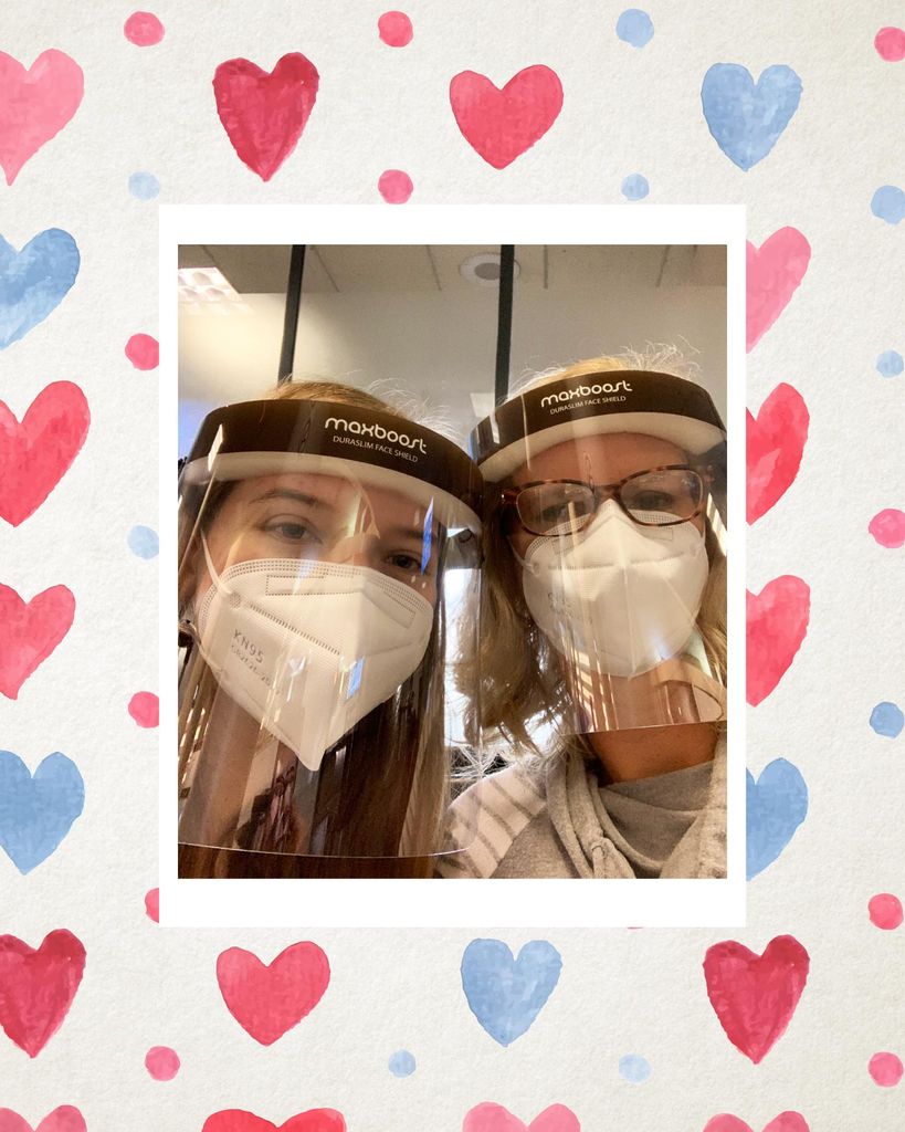 Photo of Cindy Warren and her daughter who both wear face masks and clear face shields. The photo is overlaid on a repeating pattern of blue and red watercolor hearts.