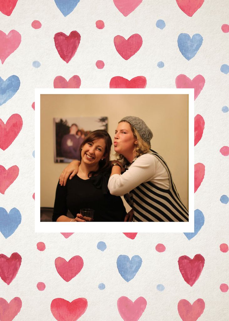 Photo of Sigal Hertshten (COM’09) and their partner leaning against each other, one makes a kissy face at the other. The photo is overlaid on a repeating pattern of blue and red watercolor hearts.