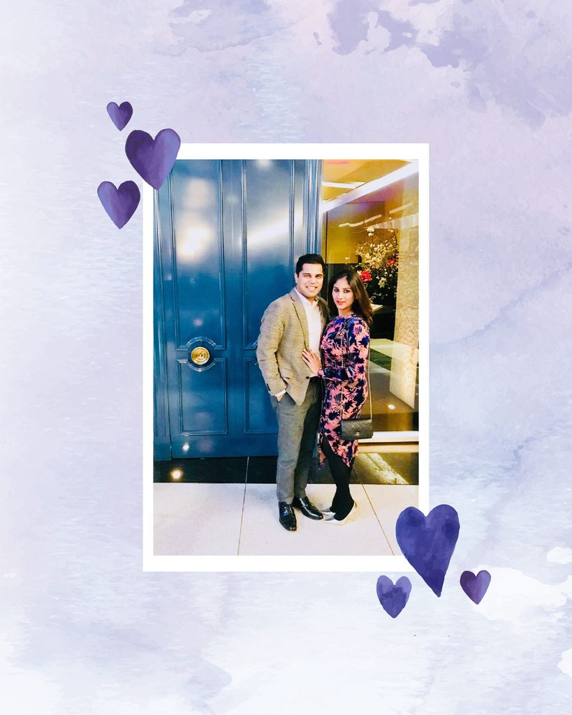 Photo of Harsh Arora and his partner looking fancy in front of a large blue door. The photo has a white border and is overlaid on a purple watercolor background; purple watercolor hearts are also overlaid.