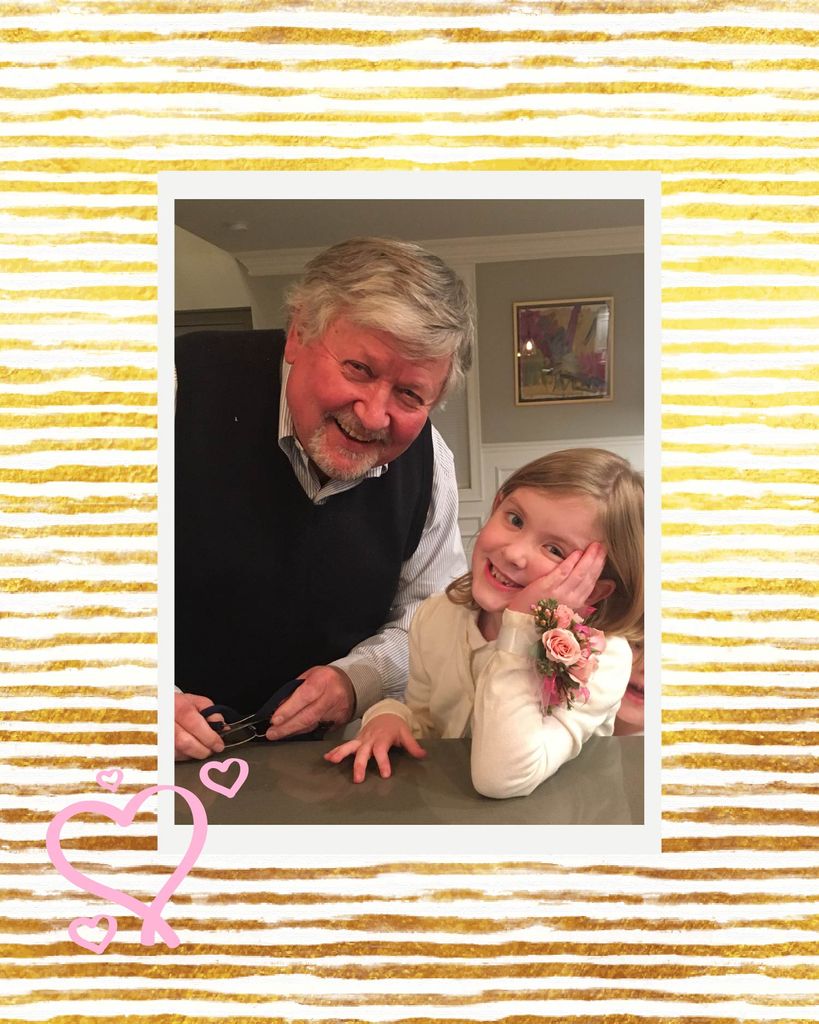 Photo of Dave Kourtz (CAS’67) and his granddaughter smiling wide as she leans on a countertop. The photo is overlaid on a white and gold striped background and a few pink hearts are drawn over the background and photo.