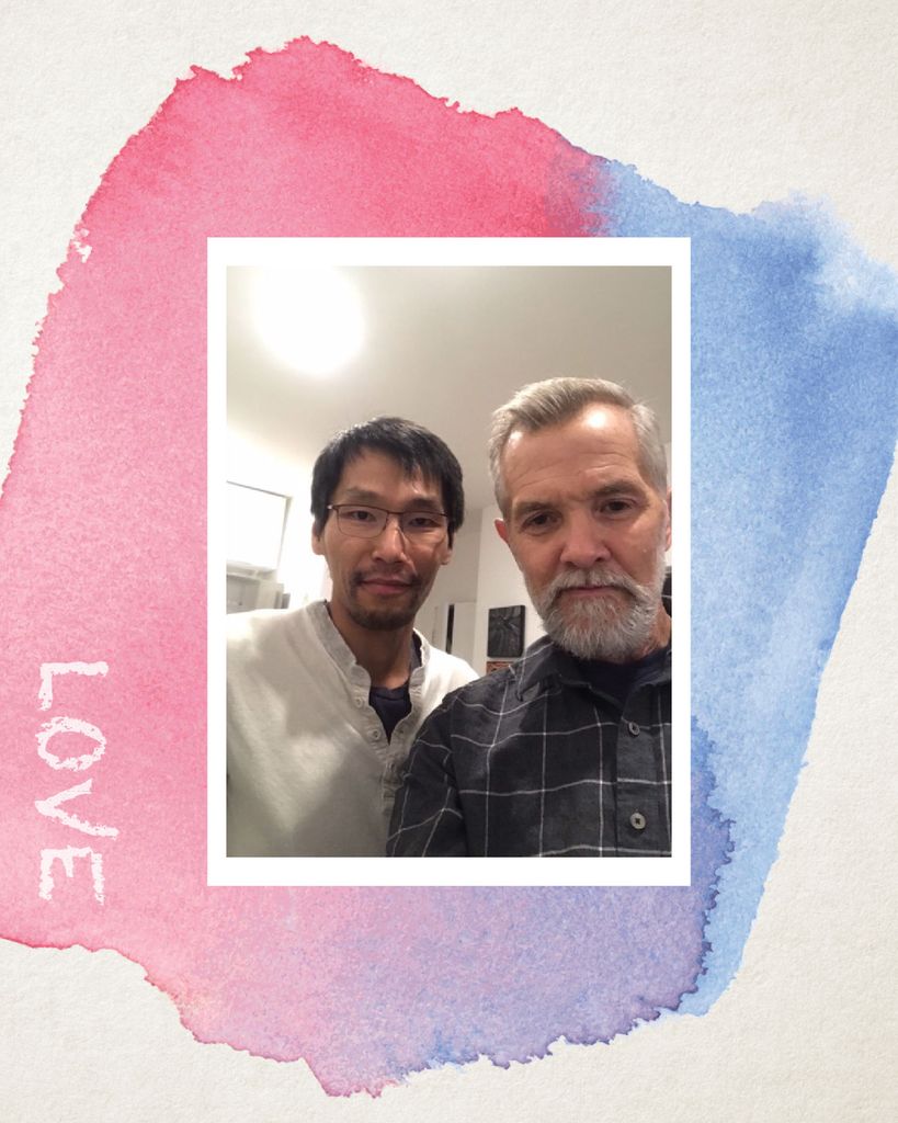 Photo of David Chard and his partner semi-smiling as they take a selfie. The photo has a white border, similar to that of a polaroid, and is on a background with a pink and blue watercolor blob. “Love” is written on the left of the blob.