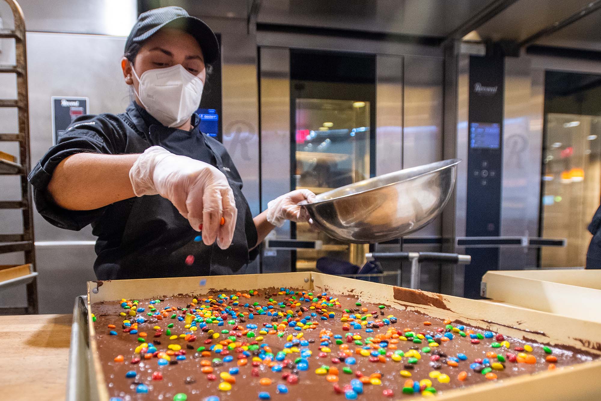 Carmen Quijada adds sprinkles to a batch of brownies.