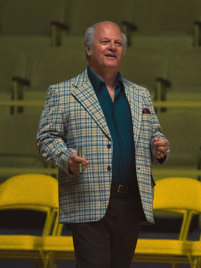 Michael Chiklis portraying Red Auerbach with TD Garden seats in the background