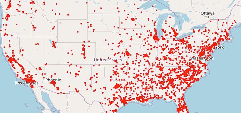 Image of a map of the lower 48 states of the United States in tan. Overlaid are a serious of red dots indicating the number of gun violence deaths in 2022 so far. The dots are concentrated around the coasts, but no state is without dots.