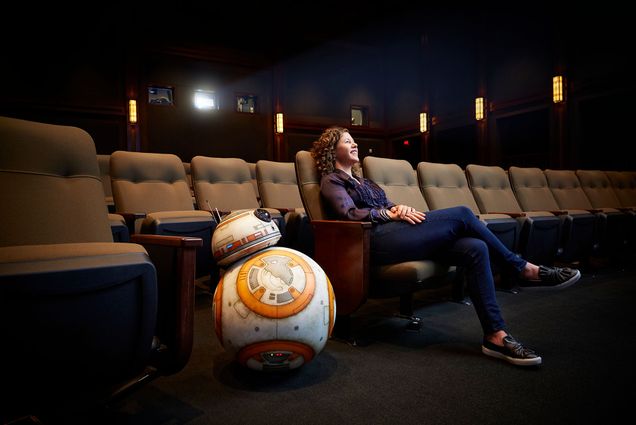 Janet Lewin helps filmmakers develop the special effects technology needed to bring characters—like the Star Wars droid BB-8—to life on screen. Here Lewin and BB-8 sit in a cinema