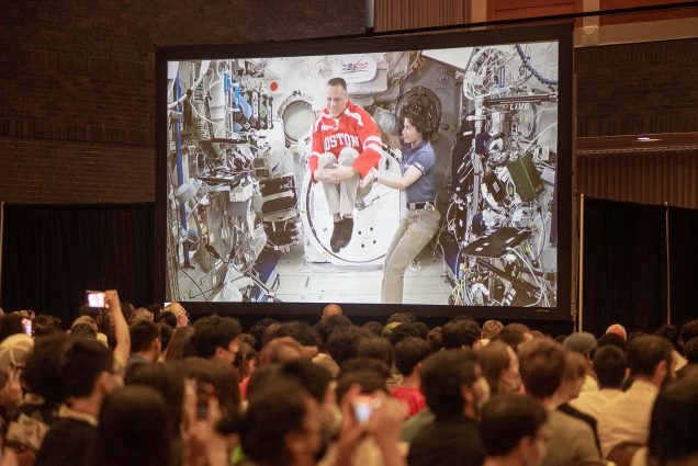 NASA astronaut Bob Hines (ENG’97) demonstrated space acrobatics with the help of fellow astronaut Samantha Cristoforetti during a live downlink from the International Space Station to the George Sherman Union’s Metcalf Ballroom on Wednesday.