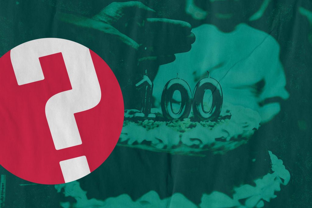 Image of a birthday cake with silver candles that read "100" on top. A hand with a lighter goes to light the birthday candles. A person is seen seated, blurred, in the background. Red Question of the Week logo and red Boston University logo are overlaid.