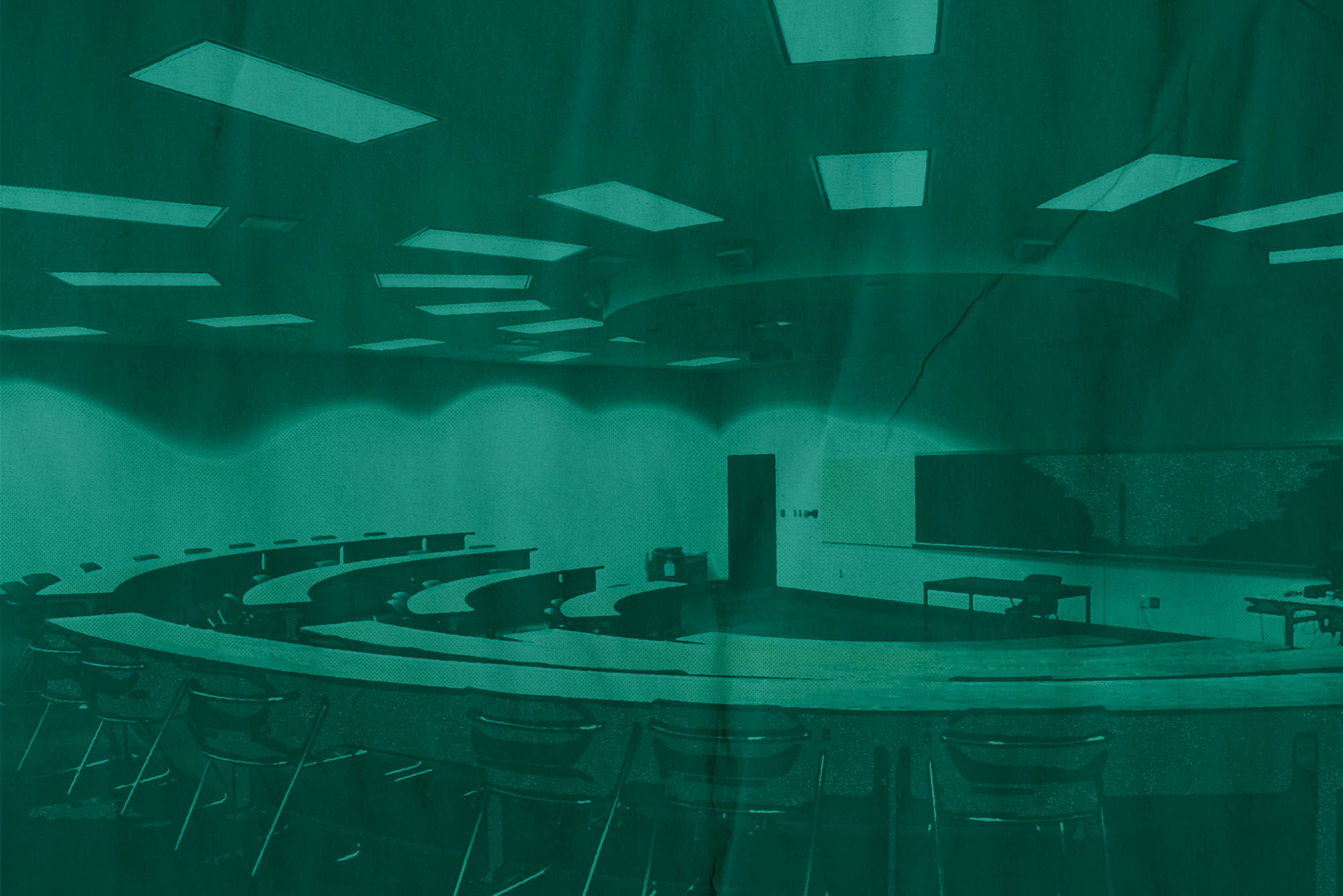 A university classroom with theatre-style crescent seating. The entire canvas is tinted green