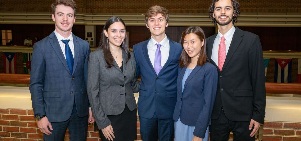 Group photo of the BU students who made it to the finals of a Questrom sustainability competition: (from left) Ryan Loughran (Questrom’24) (from left), Rachel Levine (Questrom’24), James Coyle (CAS’24), Rachel Koh (Questrom’24), and Noah Sorin (Questrom’24). They all wear business casual outfits and smile.
