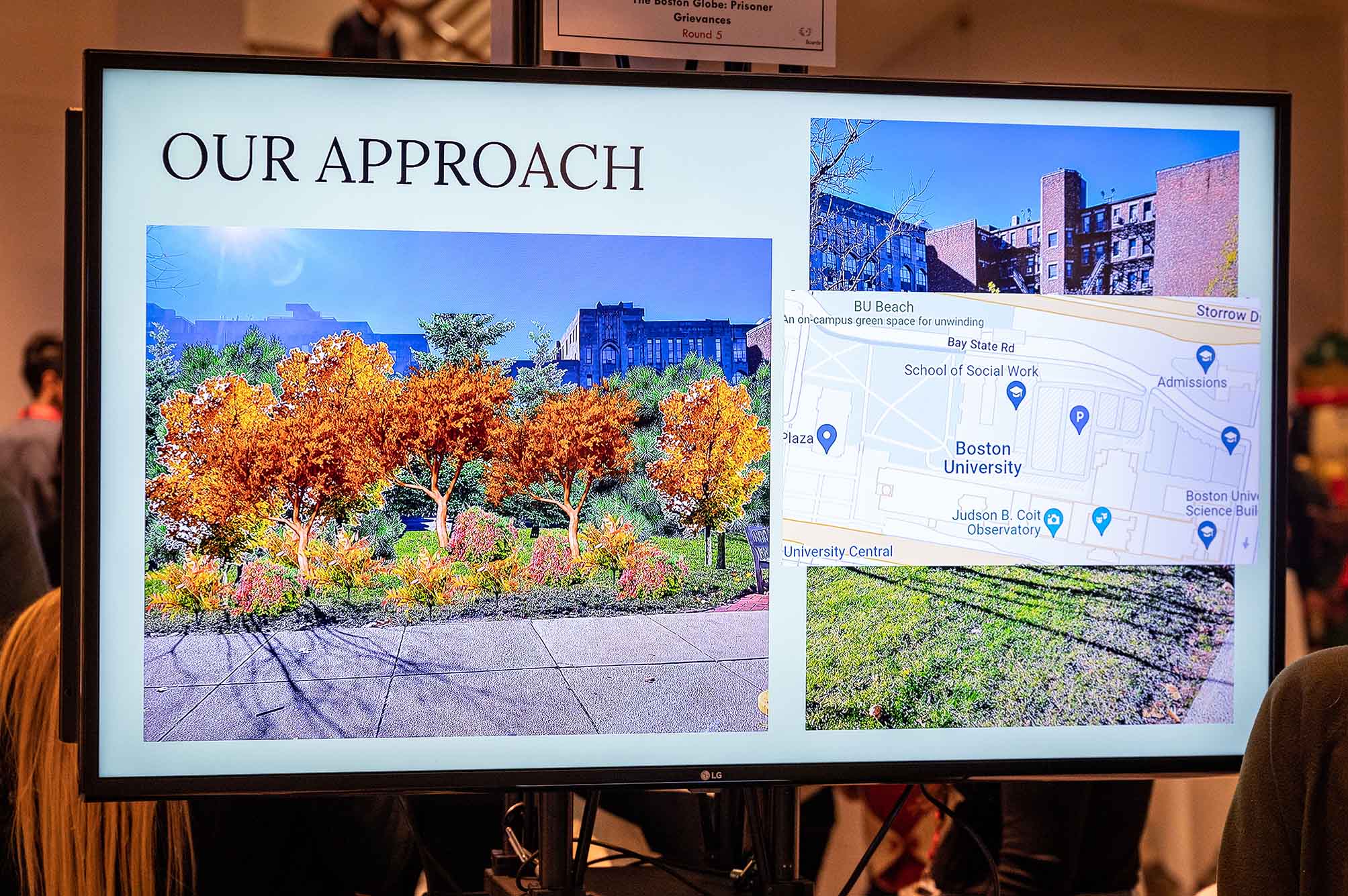 Photo: An example of a Miyawaki forest on a slide at the Cross College Challenge exhibition in Questrom on Tuesday, Dec. 13. A slide on a large screen shows in the background an overhead google street map of BU and a photo of a bunch of trees planted along a sidewalk.
