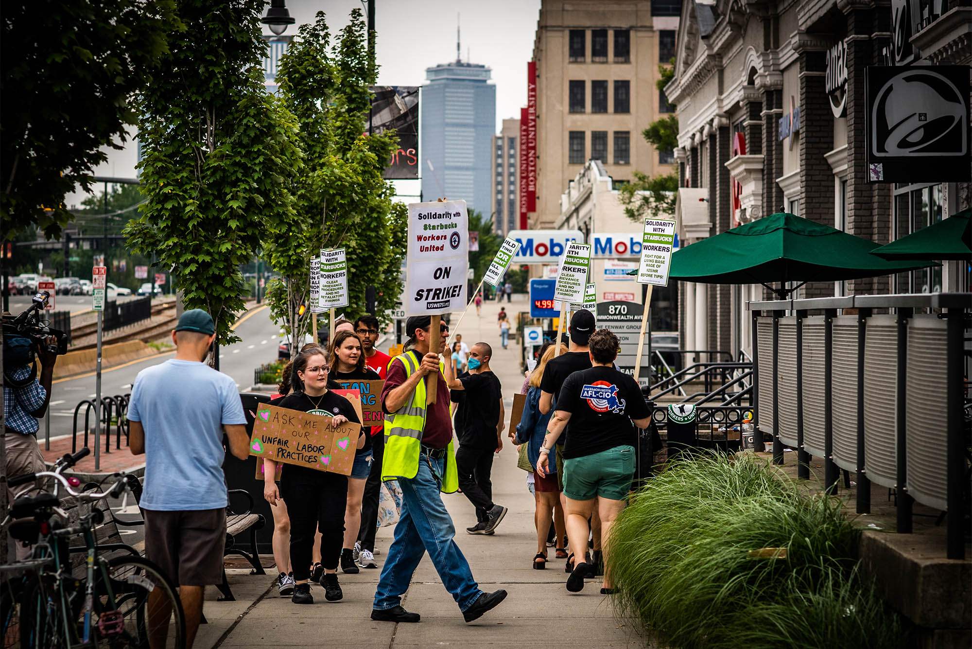 Starbucks employees picket outside of the store location on Comm Ave. on July 18, 2022. They allege that an interim store manager hired after last month’s vote to unionize has contributed to a “hostile work environment” Photo by Jackie Ricciardi for Boston University