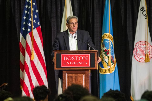 Dean Kenneth Lutchen, a white man in a gray suit wearing glasses, stands at a podium during the the NASA Downlink event with astronaut Bob Hines, PhD (ENG’97) in the GSU July 20.