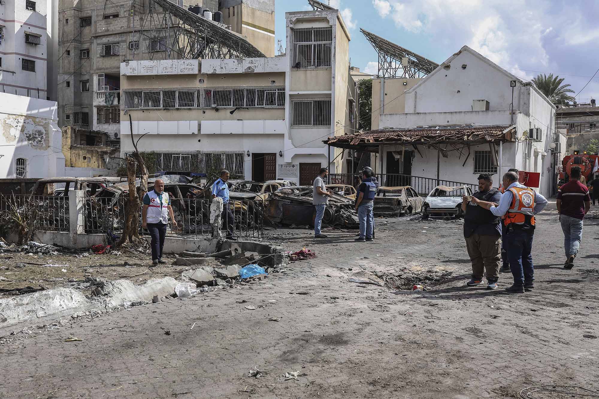 Photo: Palestinians inspect the destruction following the attack on the Ahli Arab Hospital, which killed dozens of civilians. Photo by: Mohammad Abu Elsebah/picture-alliance/dpa/AP Images