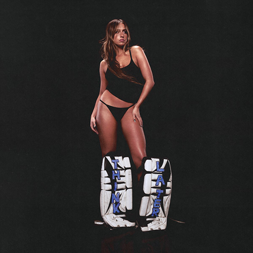 Image: Album cover features Tate McRae, a tanned white woman wearing a simple black cami and panties, and blue and white hockey guards on her shins that read "Think" and "Later" poses in an entirely black background and room.