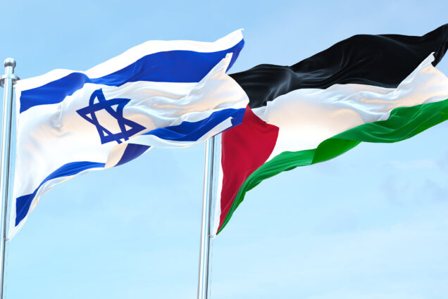 Photo: The Israel flag and Palestine flag both flying at the same height on a sunny day