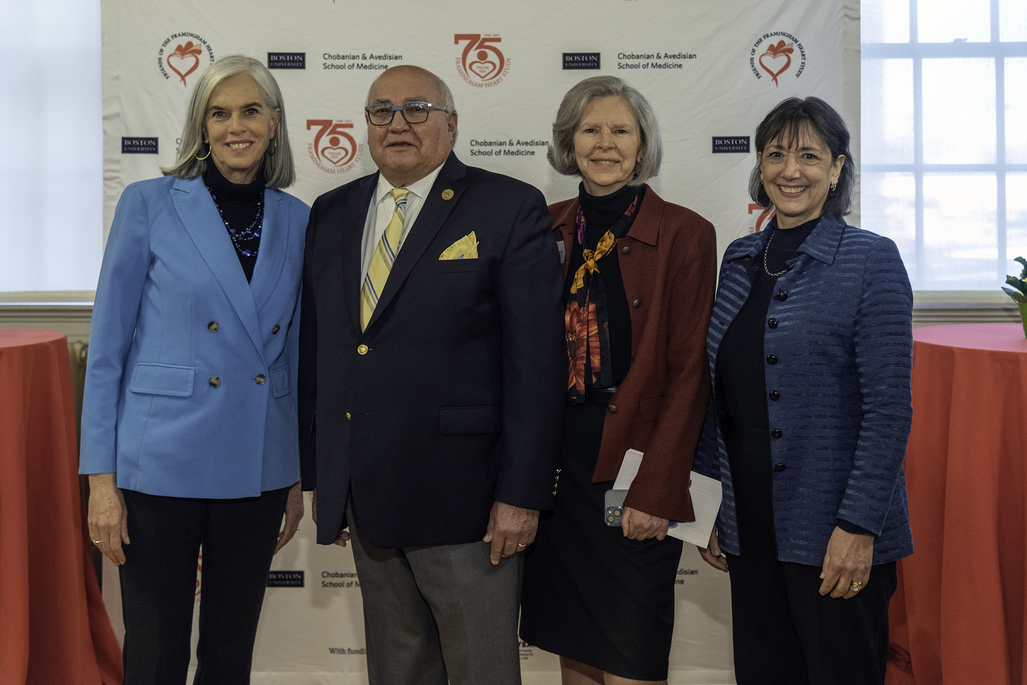 Photo: Four individuals pose for a photo.