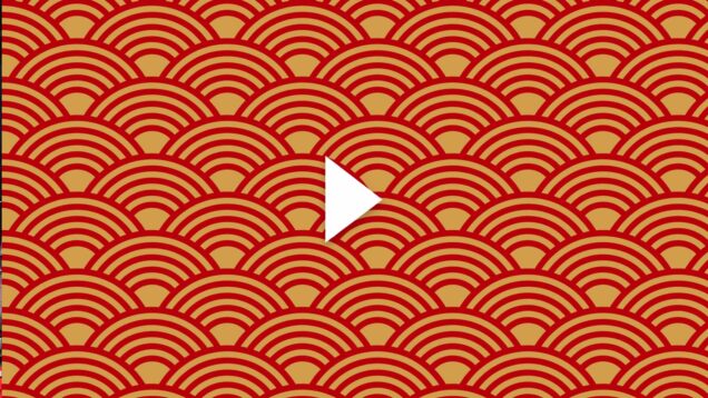 Photo: Red and gold vector image of half spirals. There is a white play button overlaid on top of the image
