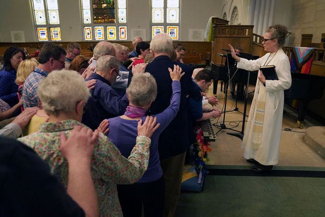 Photo: A church full of people during a busy sunday worship at a methodist service