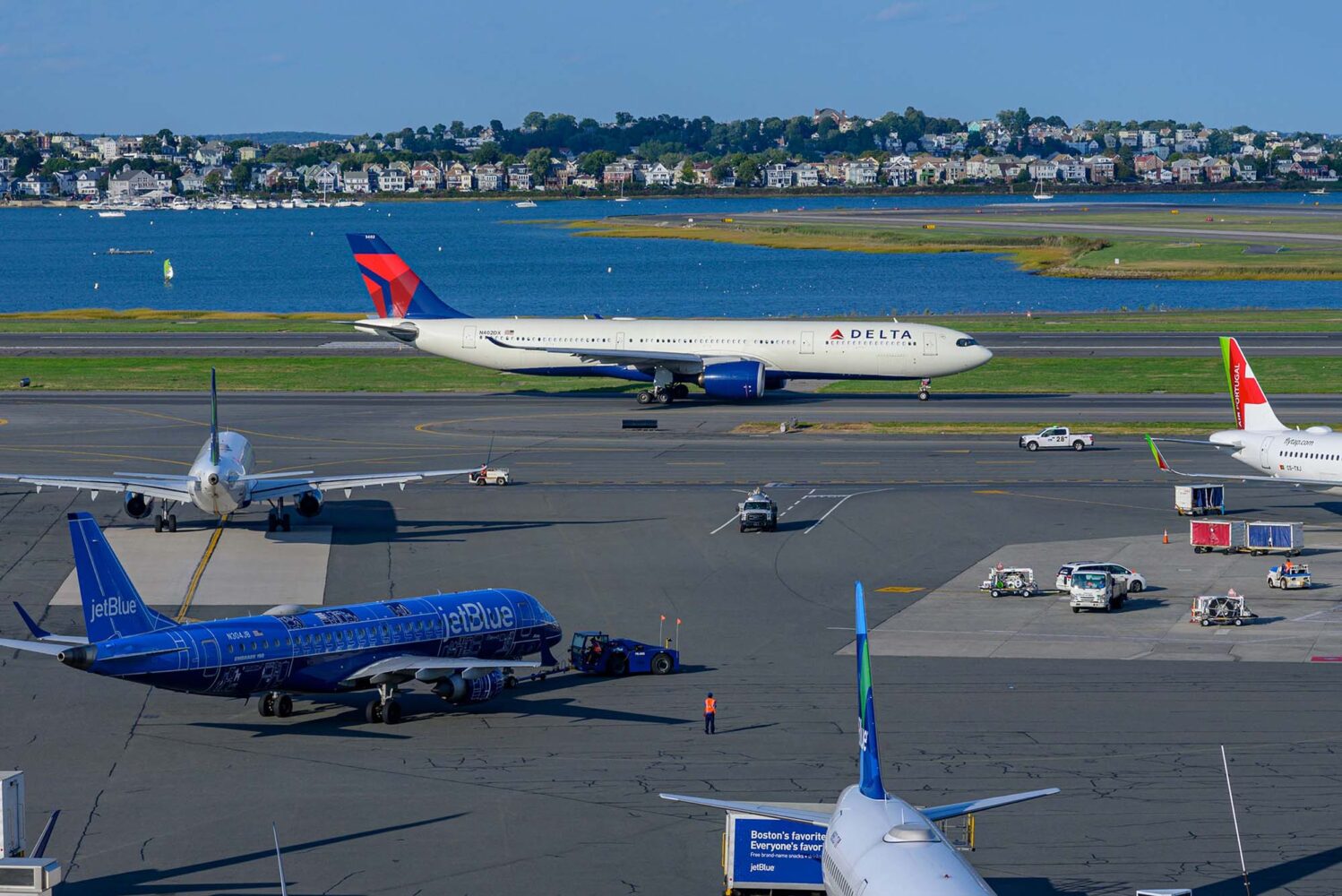 Photo: A picture of Boston Logan International Airport with water and neighborhoods in the background