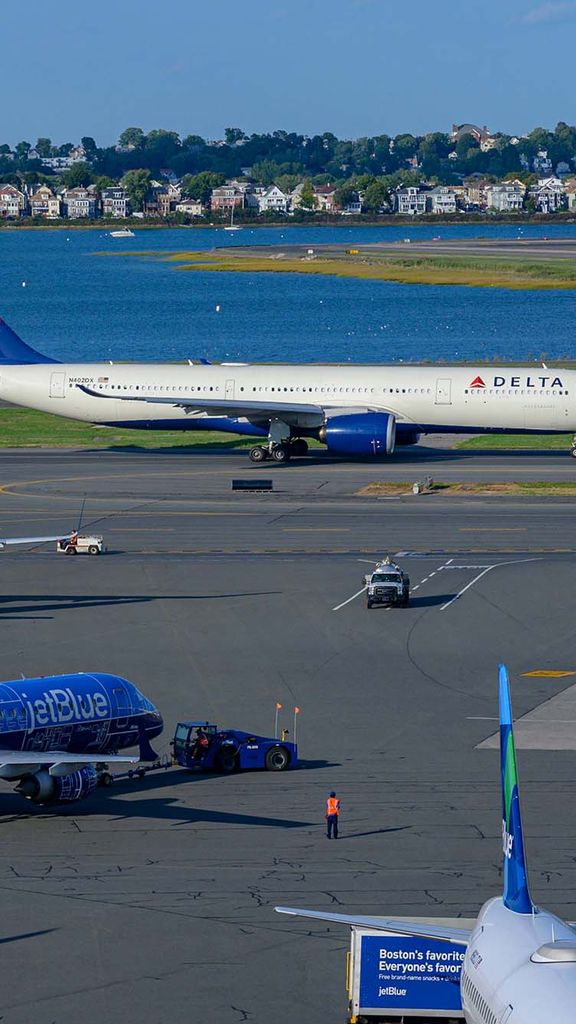 Photo: A picture of Boston Logan International Airport with water and neighborhoods in the background